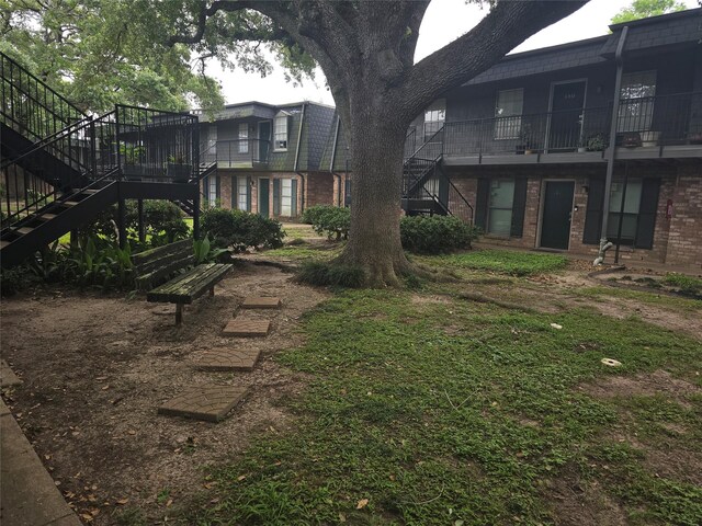 8941 Gaylord St Unit 211, Houston, TX 77024 - view of yard featuring stairway