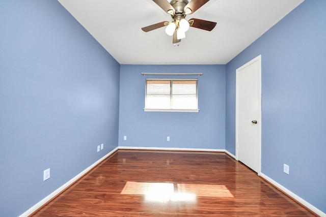 730 Columbia Ln, Deer Park, TX 77536 - spare room featuring a ceiling fan, wood finished floors, and baseboards
