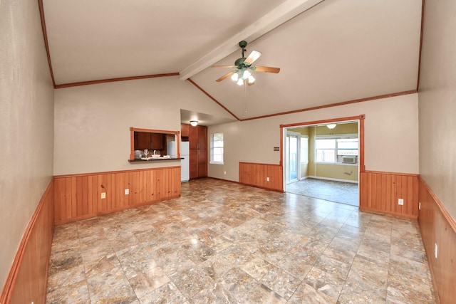730 Columbia Ln, Deer Park, TX 77536 - unfurnished living room with a wainscoted wall, healthy amount of natural light, wood walls, and ceiling fan