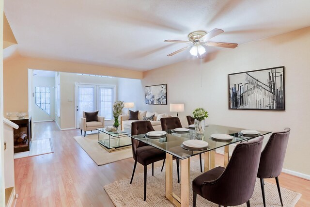2425 Holly Hall St Unit 149, Houston, TX 77054 - dining area with ceiling fan, light wood-style floors, and baseboards