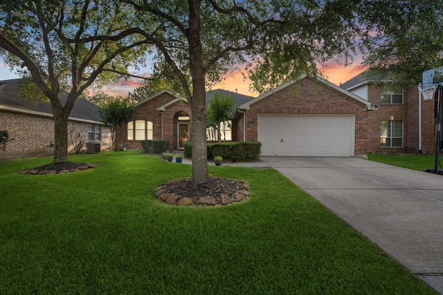 18011 Outback Lakes Trl, Humble, TX 77346 - single story home with brick siding, an attached garage, a lawn, and driveway