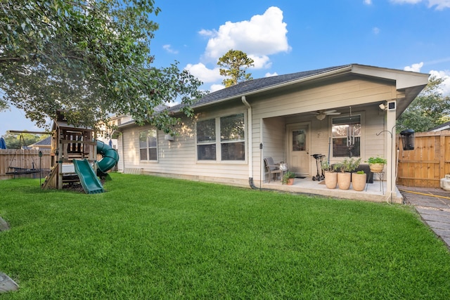 18011 Outback Lakes Trl, Humble, TX 77346 - back of house featuring a playground, ceiling fan, and a patio