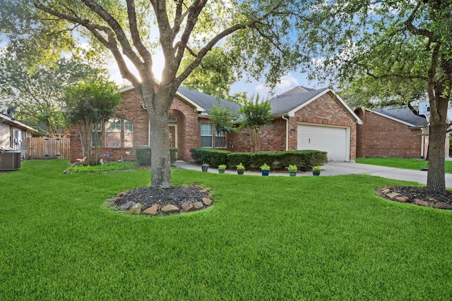 18011 Outback Lakes Trl, Humble, TX 77346 - view of front facade featuring brick siding, a garage, driveway, central AC, and roof with shingles