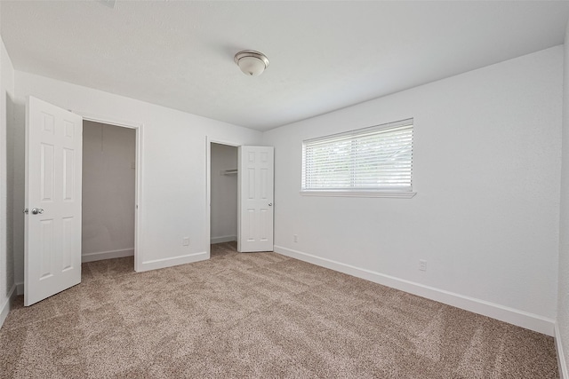 7011 Maple Fox Dr, Humble, TX 77338 - unfurnished bedroom featuring baseboards, carpet floors, and a closet