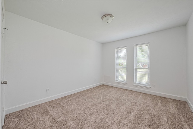7011 Maple Fox Dr, Humble, TX 77338 - empty room featuring baseboards and carpet