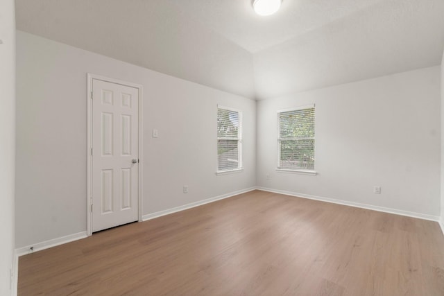 19827 Lajuana Ln, Spring, TX 77388 - unfurnished room with light wood-style flooring, baseboards, and lofted ceiling
