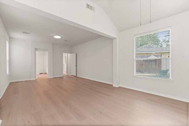 19827 Lajuana Ln, Spring, TX 77388 - empty room featuring light wood-type flooring, baseboards, and lofted ceiling