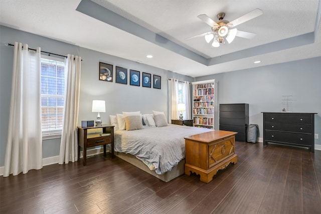 1731 W 22nd St, Houston, TX 77008 - bedroom with a tray ceiling, dark wood finished floors, baseboards, and recessed lighting