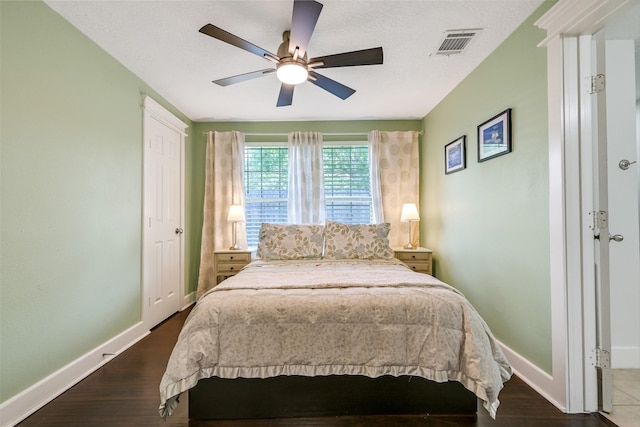 1731 W 22nd St, Houston, TX 77008 - bedroom featuring baseboards, dark wood-style floors, and ceiling fan