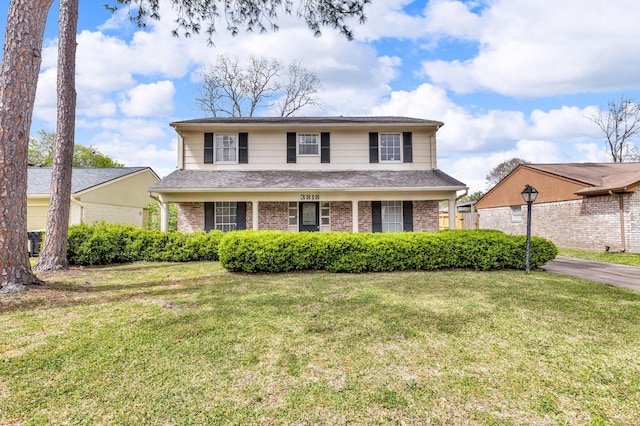 3818 Glen Cove Cir, Missouri City, TX 77459 - traditional-style home with a front lawn and brick siding