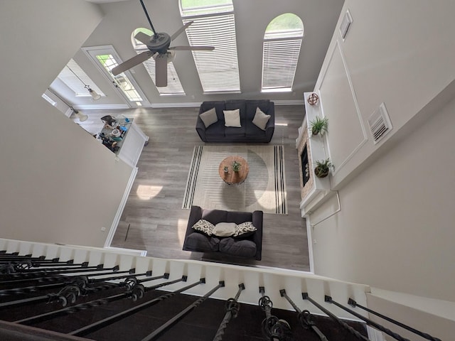 10067 Lazy Meadows Dr, Houston, TX 77064 - living room with a ceiling fan, wood finished floors, and baseboards