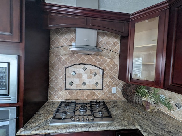 10067 Lazy Meadows Dr, Houston, TX 77064 - kitchen view of stainless steel appliances, tasteful backsplash, glass insert cabinets, and wall chimney exhaust hood