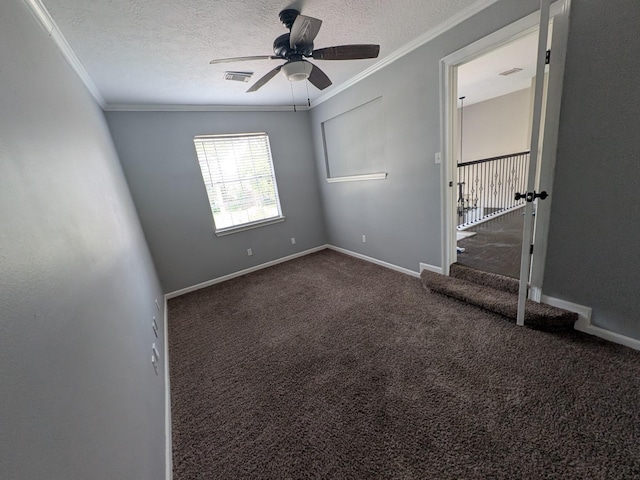 10067 Lazy Meadows Dr, Houston, TX 77064 - spare room featuring ornamental molding, a ceiling fan, dark colored carpet, a textured ceiling, and baseboards