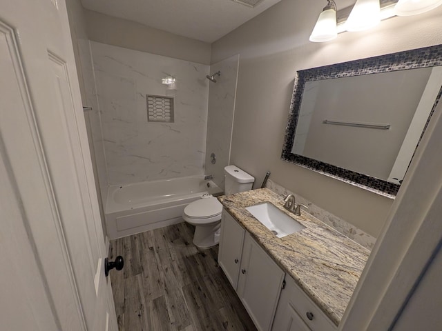 10067 Lazy Meadows Dr, Houston, TX 77064 - bathroom featuring toilet, wood finished floors, vanity, and shower / bathtub combination