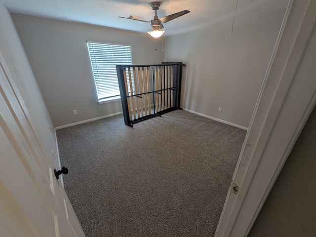 10067 Lazy Meadows Dr, Houston, TX 77064 - spare room with carpet floors, baseboards, and ceiling fan