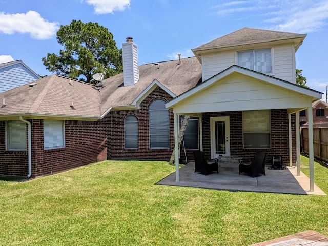 10067 Lazy Meadows Dr, Houston, TX 77064 - back of property featuring a patio area, brick siding, a chimney, and a shingled roof