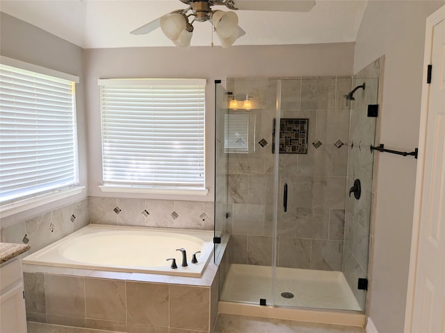 10067 Lazy Meadows Dr, Houston, TX 77064 - bathroom featuring a bath, a shower stall, ceiling fan, and vanity
