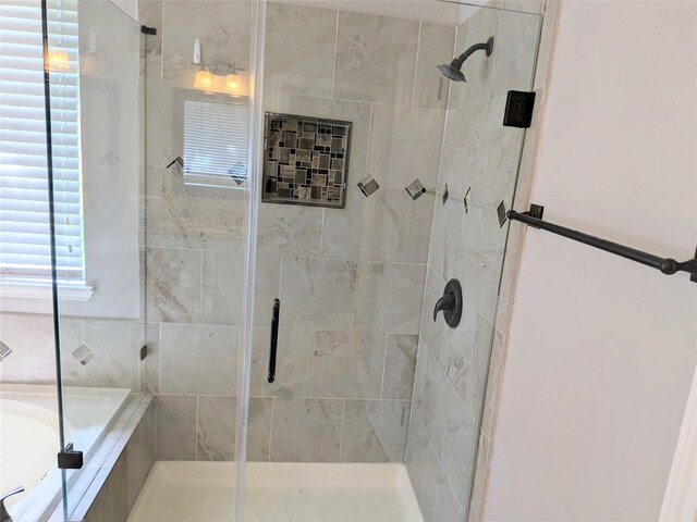 10067 Lazy Meadows Dr, Houston, TX 77064 - bathroom with a stall shower and a relaxing tiled tub