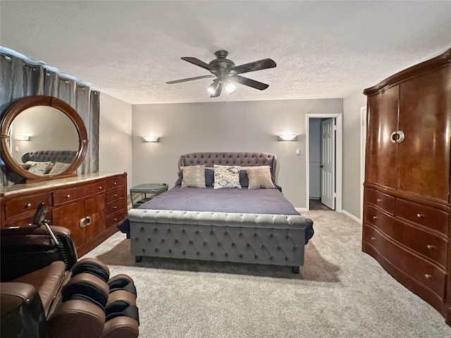 17407 Majestic Forest Dr, Spring, TX 77379 - bedroom featuring light carpet, a textured ceiling, a ceiling fan, and baseboards