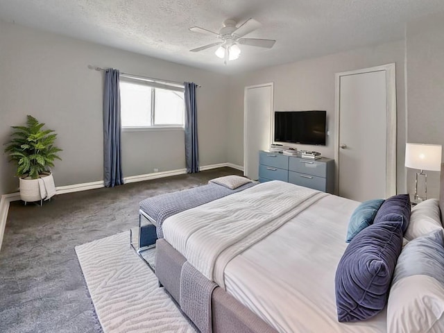 17407 Majestic Forest Dr, Spring, TX 77379 - carpeted bedroom with baseboards, a ceiling fan, and a textured ceiling