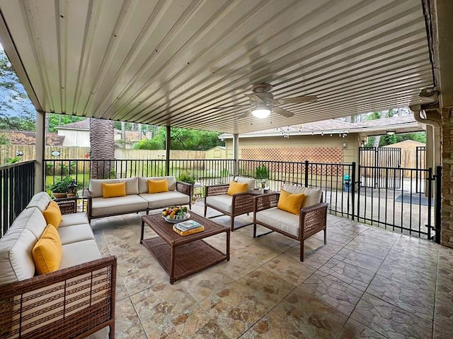 17407 Majestic Forest Dr, Spring, TX 77379 - fenced backyard with outdoor lounge area, a patio, and a ceiling fan