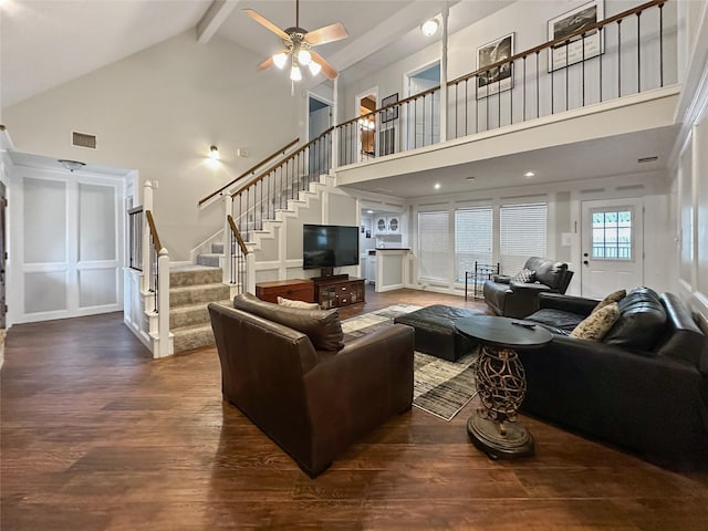 17407 Majestic Forest Dr, Spring, TX 77379 - living area with high vaulted ceiling, dark wood-style flooring, stairs, beamed ceiling, and a ceiling fan