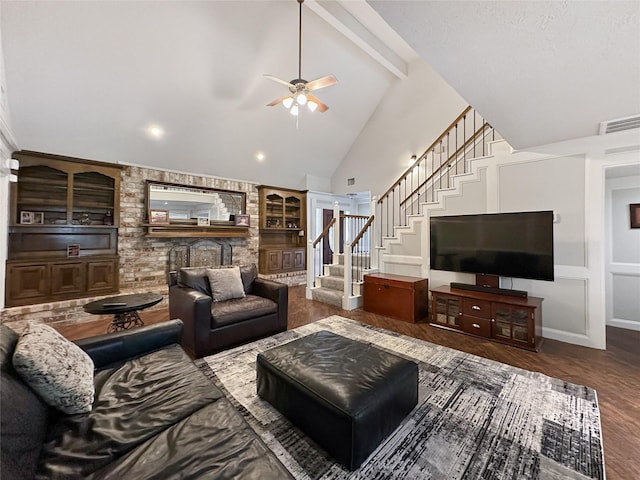 17407 Majestic Forest Dr, Spring, TX 77379 - living area with stairway, wood finished floors, a ceiling fan, high vaulted ceiling, and beam ceiling