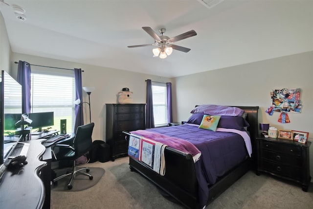 8434 Violet Hills Ln, Rosharon, TX 77583 - bedroom with light colored carpet, a desk, and a ceiling fan