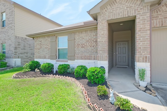 8434 Violet Hills Ln, Rosharon, TX 77583 - view of exterior entry featuring brick siding and a lawn