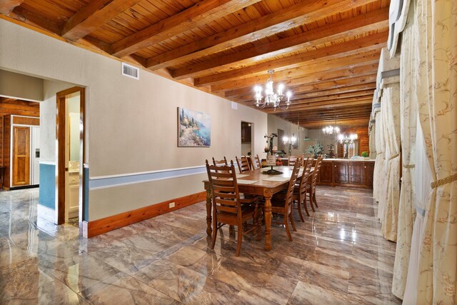 1000 W Polk St, Livingston, TX 77351 - dining room with a chandelier, wooden ceiling with exposed beams, marble finish flooring, and baseboards