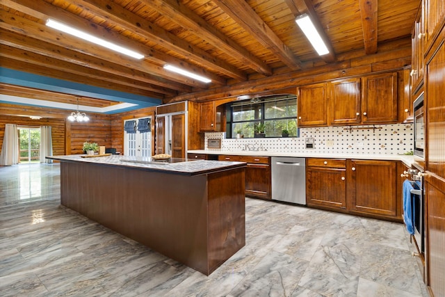1000 W Polk St, Livingston, TX 77351 - kitchen with appliances with stainless steel finishes, a chandelier, a kitchen island, tasteful backsplash, and wood ceiling with exposed beams