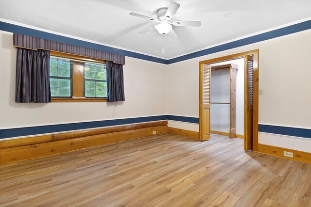 1000 W Polk St, Livingston, TX 77351 - spare room featuring baseboards, ceiling fan, and wood finished floors