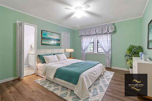 1000 W Polk St, Livingston, TX 77351 - bedroom with wood finished floors, crown molding, baseboards, ensuite bathroom, and ceiling fan
