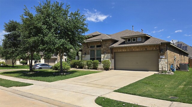 3207 Karleigh Way, Richmond, TX 77406 - view of front of property with central AC unit, a garage, a front yard, and brick siding