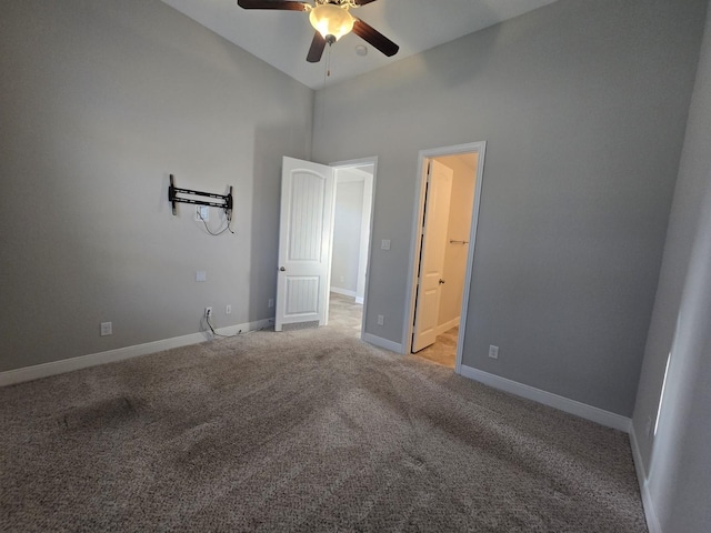 3207 Karleigh Way, Richmond, TX 77406 - unfurnished bedroom with a towering ceiling, light carpet, baseboards, ensuite bath, and a ceiling fan