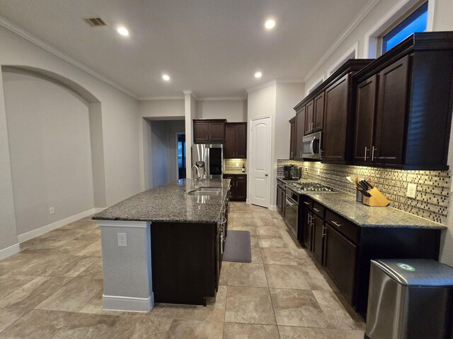 3207 Karleigh Way, Richmond, TX 77406 - kitchen with stainless steel appliances, tasteful backsplash, dark stone counters, crown molding, and recessed lighting
