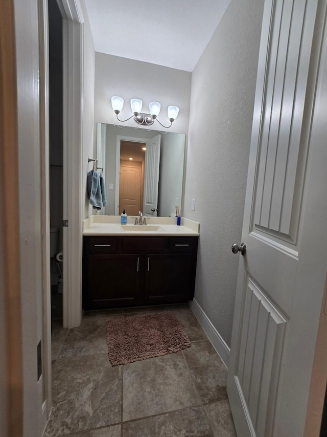 3207 Karleigh Way, Richmond, TX 77406 - bathroom with a chandelier, vanity, toilet, and baseboards