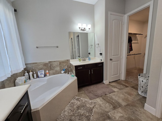 3207 Karleigh Way, Richmond, TX 77406 - bathroom with a garden tub, vanity, and a spacious closet