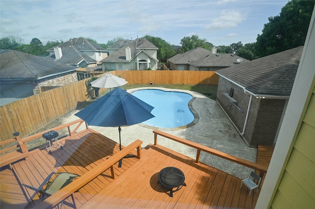 15202 Delbarton Dr, Houston, TX 77083 - view of pool featuring a deck, a fenced backyard, outdoor dining area, and a residential view
