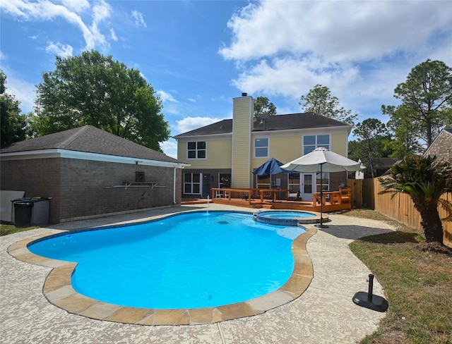 15202 Delbarton Dr, Houston, TX 77083 - view of swimming pool featuring a fenced backyard, a wooden deck, and a pool with connected hot tub