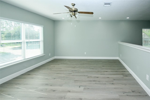 15202 Delbarton Dr, Houston, TX 77083 - spare room featuring a ceiling fan, wood finished floors, recessed lighting, and baseboards
