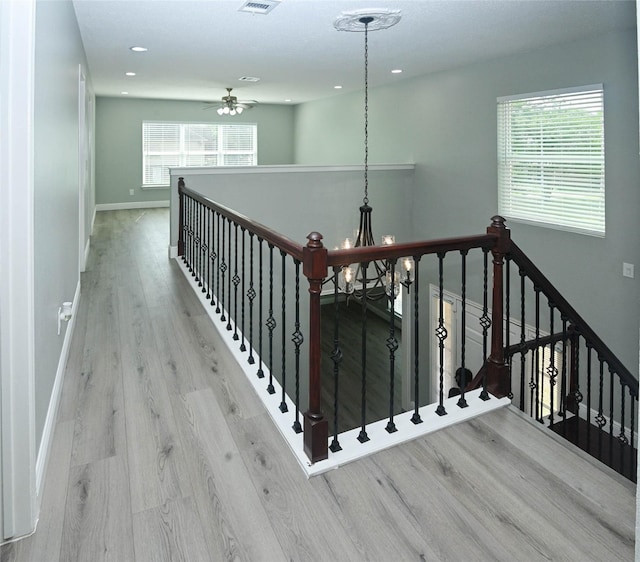 15202 Delbarton Dr, Houston, TX 77083 - stairway with wood finished floors, baseboards, recessed lighting, and ceiling fan