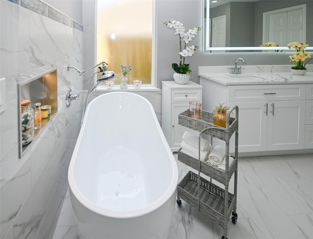 15202 Delbarton Dr, Houston, TX 77083 - full bathroom featuring marble look tiles, a freestanding bath, and vanity