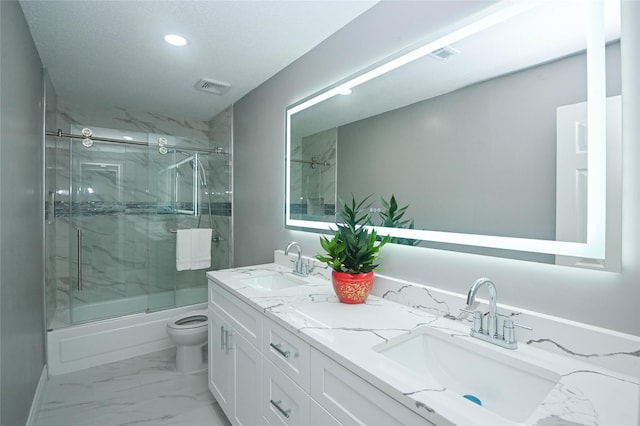 15202 Delbarton Dr, Houston, TX 77083 - full bath featuring bath / shower combo with glass door, recessed lighting, toilet, double vanity, and marble look tiles