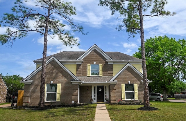 15202 Delbarton Dr, Houston, TX 77083 - view of front of house featuring a front yard, brick siding, and roof with shingles