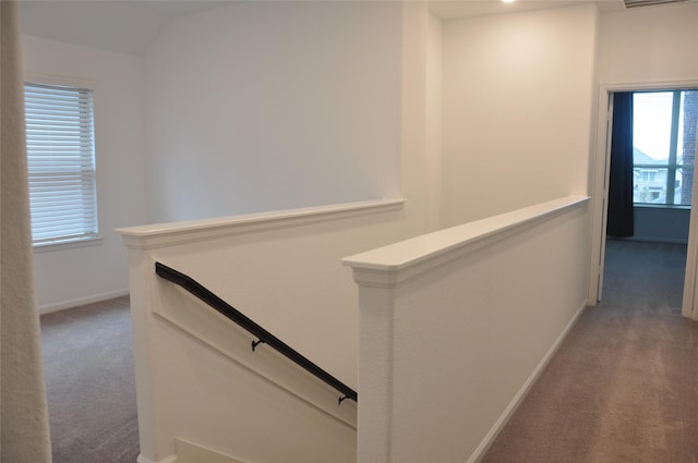 673 Royal Arch Dr, Conroe, TX 77304 - corridor with an upstairs landing, carpet, baseboards, and vaulted ceiling