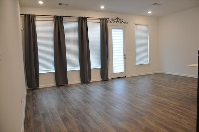 673 Royal Arch Dr, Conroe, TX 77304 - spare room with baseboards, dark wood-style floors, and recessed lighting