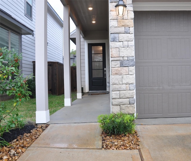 673 Royal Arch Dr, Conroe, TX 77304 - doorway to property featuring stone siding and fence
