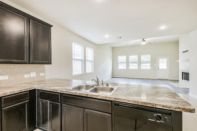 12638 Silver Winter Trl, Houston, TX 77014 - kitchen featuring black dishwasher, a sink, ceiling fan, open floor plan, and a peninsula