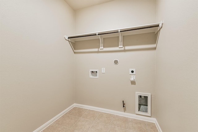 12638 Silver Winter Trl, Houston, TX 77014 - washroom featuring gas dryer hookup, hookup for an electric dryer, hookup for a washing machine, baseboards, and light tile patterned flooring